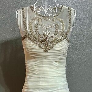New Jovani very fitted with a showstopper back
